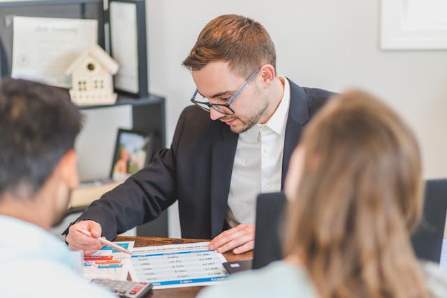 mortgage broker going over plans with property investors